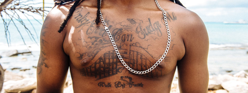 Image of a man with chest tattoos
